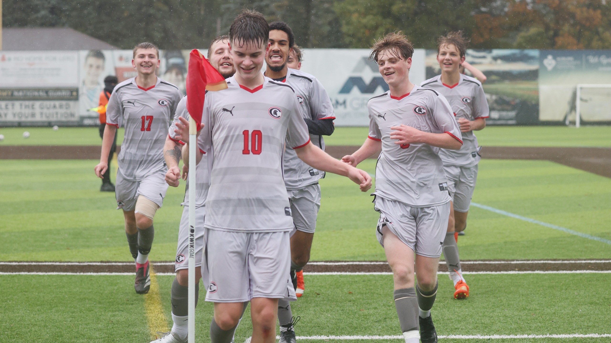 The Spartans celebrate Jake Botterill (#10)'s second goal of the first half in their 6-1 playoff win over Hudson Valley CC at Falcon Park on Sunday.
